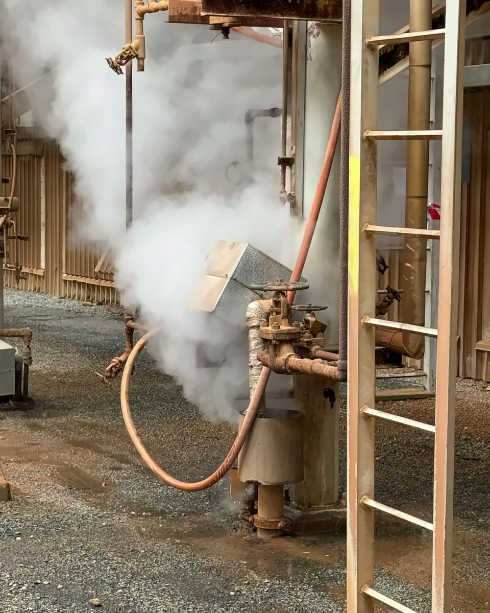 Steam venting from a valve on an industrial plant